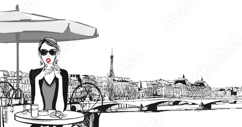 Young woman having breakfast in Paris © Isaxar
