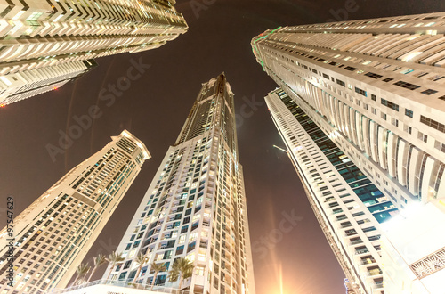 Street view of Dubai Marina skyscrapers at night