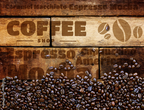 Fototapeta Coffee beans on wood background