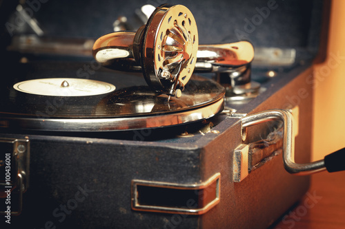 Fototapeta na wymiar Old record player gramophone needle on record closeup. vintage toning