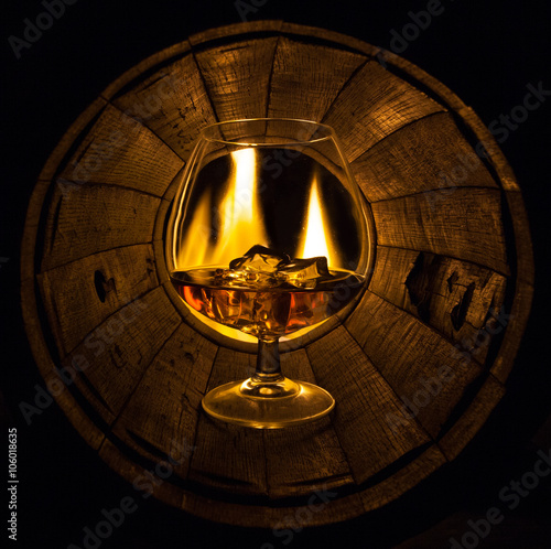 The oak barrel burning glass with cognac