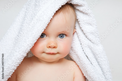 baby under a towel