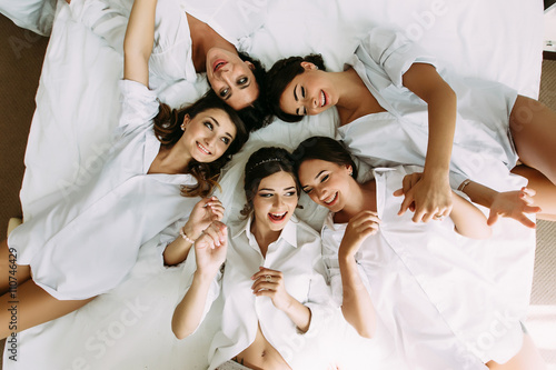 Bride and her bridesmaids in the white clothes