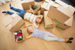 Couple lying on the floor in their new apartment Couple lying on the floor in their new apartment