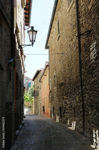 Narrow alley in San Marino under blue sky
