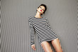 fashion woman in striped dress on background fashion woman in striped dress on background
