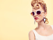 Fashion portrait Hipster Model woman, Stylish hairstyle. Fashion Makeup. Blond sexy Model, Trendy Glamour fashion Sunglasses. Playful cheeky fashion girl. Unusual Creative.Party disco mohawk hairstyle Fashion portrait Hipster Model woman, Stylish hairstyle. Fashion Makeup. Blond sexy Model, Trendy Glamour fashion Sunglasses. Playful cheeky fashion girl. Unusual Creative.Party disco mohawk hairstyle