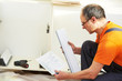 two kitchen installers at carpenter work two kitchen installers at carpenter work