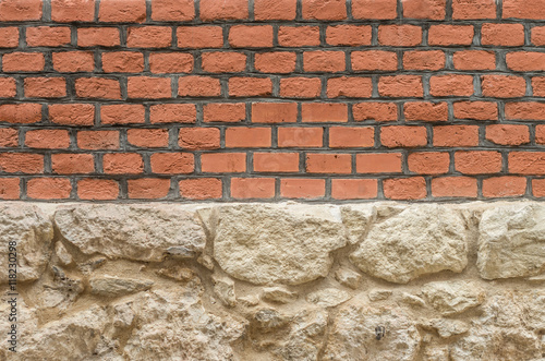 red brick wall on limestone foundation