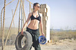Beautiful worker holding a safety helmet and a wheel Beautiful worker holding a safety helmet and a wheel