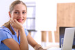 Young businesswoman working on a laptop Young businesswoman working on a laptop
