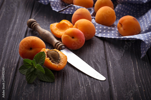 Sweet apricots on wooden background