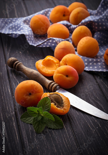 Sweet apricots on wooden background