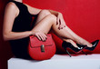woman legs in high heels fashion shoes with red bag woman legs in high heels fashion shoes with red bag