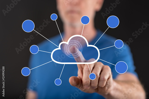 Man touching a cloud networking on a touch screen