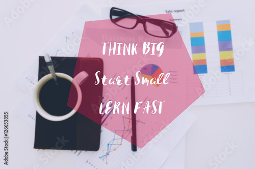 Inspirational motivation quote about business on clipboard background and office desk with laptop, notebook and coffee cup. Photo by pnopporn085