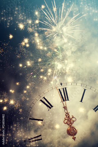  Abstract background with fireworks and clock close to midnight