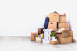 Move. Cardboard boxes in empty room corner. Move. Cardboard boxes in empty room corner.
