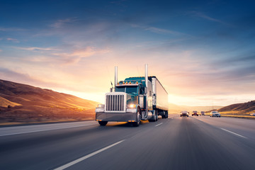 American style truck on freeway pulling load. Transportation the