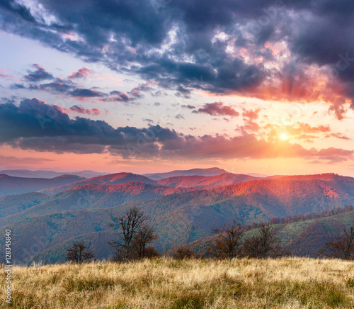 Landscape of colorful sunset in the autumn mountains.