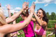 Group of women runners celebrating success and giving five. Group of women runners celebrating success and giving five.