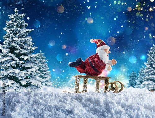 Puppet Santa Claus on snow