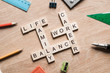 Words work life balance and family on table collected with wooden cubes Words work life balance and family on table collected with wooden cubes