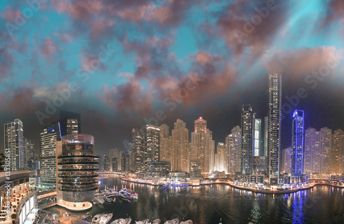Dubai Marina night aerial skyline from rooftop. Beautiful skyscr