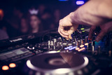 DJ plays music on his Pioneer deck in party