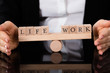Life And Work Blocks Balancing On Seesaw Life And Work Blocks Balancing On Seesaw