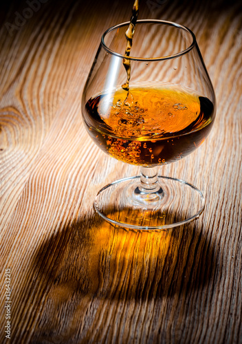 Whiskey or brandy on a wooden table