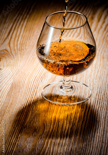 Whiskey or brandy on a wooden table
