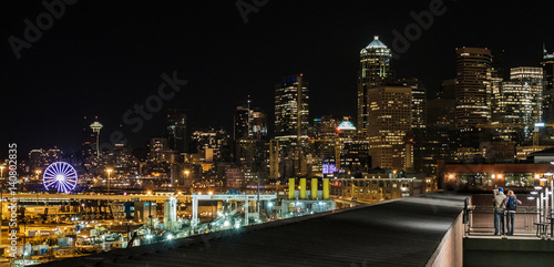 Tourists taking in the Seattle night skyline