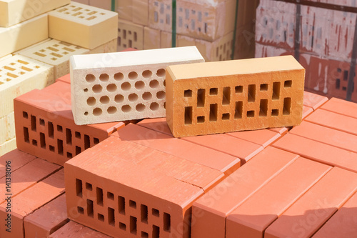 Perforated bricks of different colors and shapes of holes