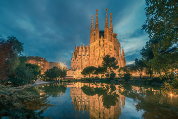 Barcelona, Catalonia, Spain: Basicila and Expiatory Church of the Holy Family, known as Sagrada Familia at sunset 
