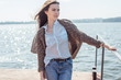 Spring or summer portrait of a beautiful young woman smiling happy student outdoor sea or ocean or lake Spring or summer portrait of a beautiful young woman smiling happy student outdoor sea or ocean or lake
