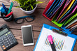 Office desktop with graphs and charts, documents and modern digital devices. Business background Office desktop with graphs and charts, documents and modern digital devices. Business background