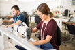 Tailors working in a textile factory Tailors working in a textile factory