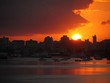 Sunset over Old San Juan waterfront A big sun sets over the port in the Old San Juan District, Puerto Rico Sunset over Old San Juan waterfront A big sun sets over the port in the Old San Juan District, Puerto Rico