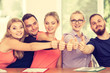 Happy group of students with thumbs up Happy group of students with thumbs up