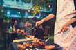 Asian woman are cooking for a group of friends to eat barbecue Asian woman are cooking for a group of friends to eat barbecue
