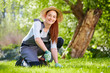 Young woman working in the garden Young woman working in the garden