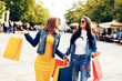 Two young women in shopping in the city down town Two young women in shopping in the city down town