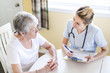 Senior woman with her caregiver at home Senior woman with her caregiver at home