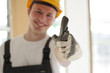 Handwerker positiv lächelnd auf einer Baustelle Handwerker positiv lächelnd auf einer Baustelle