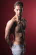Sportive, attractive, good looking man or boy posing for the camera in studio. Sportive, attractive, good looking man or boy posing for the camera in studio.