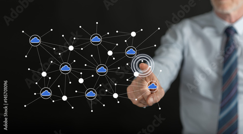 Man touching a cloud networking on a touch screen