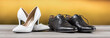 White high heel shoes and luxury black male shoes White high heel shoes and luxury black male shoes