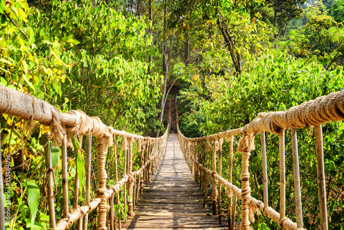Fototapeta na wymiar Beautiful footbridge made from rope and bamboo