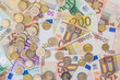 euro coin lying on banknotes close up euro coin lying on banknotes close up